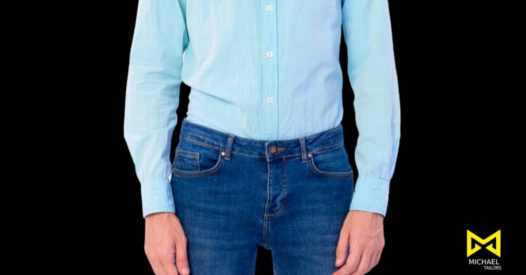 Man in light blue shirt and jeans