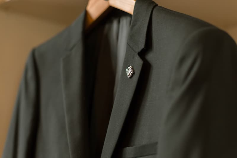 Close-up of a black blazer with pin