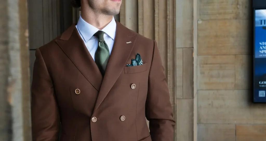 Man in a brown suit with tie