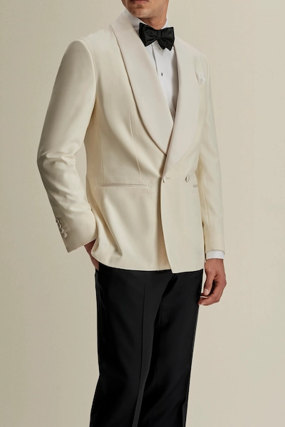 Man in formal cream tuxedo