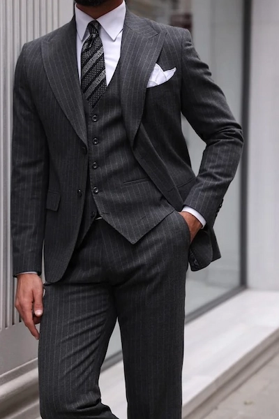 Man in a stylish gray pinstripe suit
