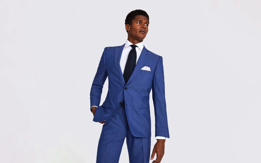 Man in blue suit with confident pose