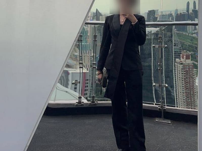 Person in black outfit on rooftop terrace