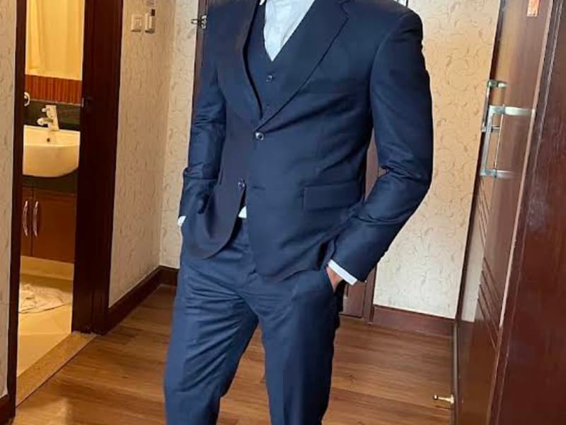 Man in a formal suit in a room
