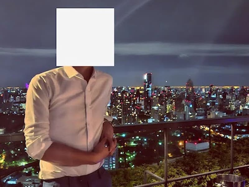Person overlooking a city skyline at night