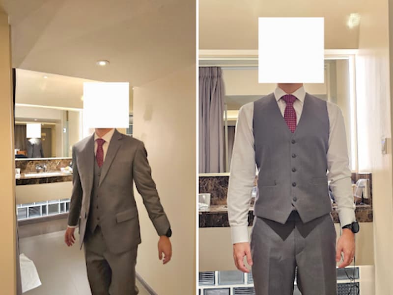 Man in a suit walking in a hotel
